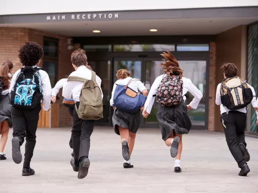 Students running into school.