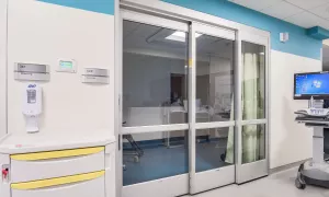 A set of sliding doors in a hospital room.